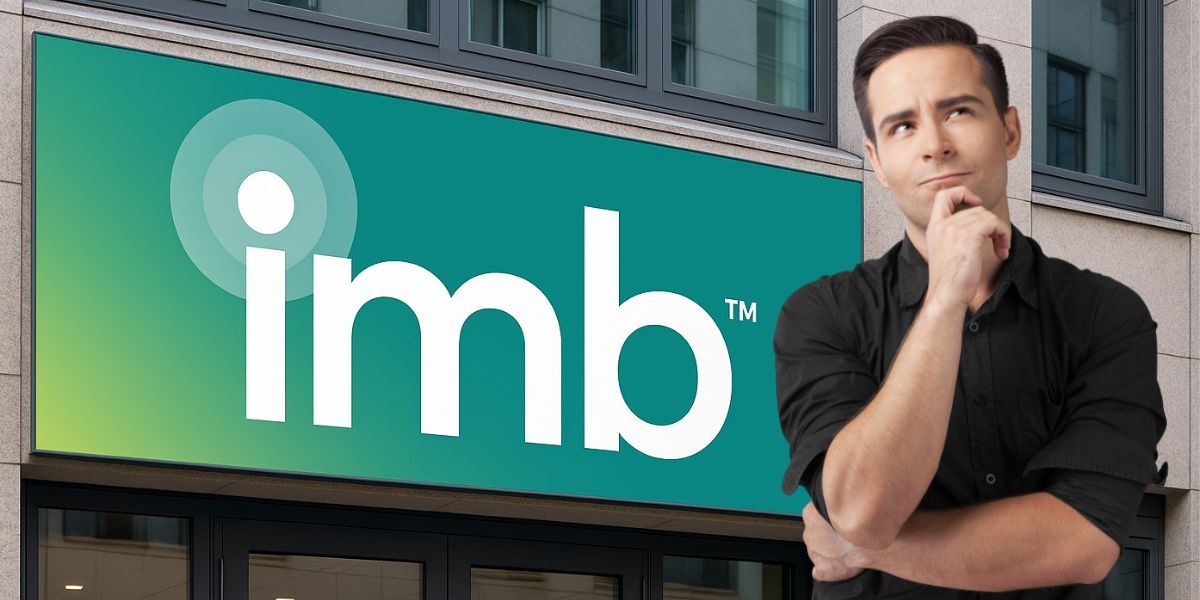 IMB™ sign outside an office with a professional considering career options, symbolizing independence in mortgage brokerage.