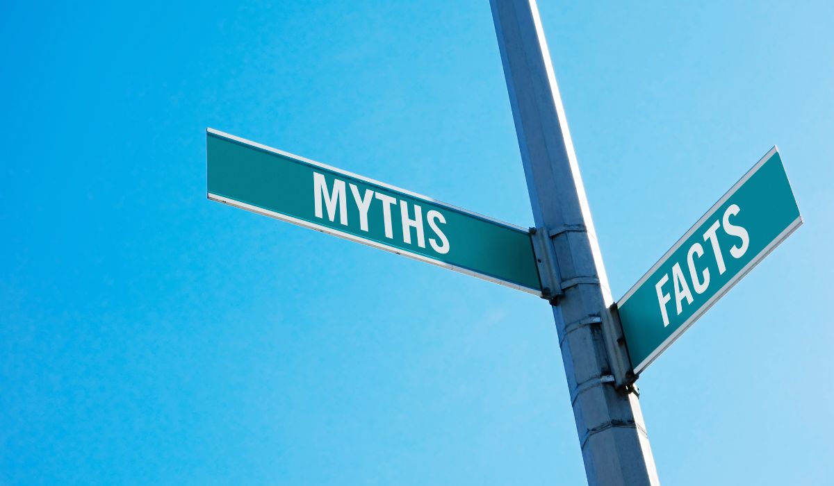 Illustration of intersecting street signs for myths and facts
